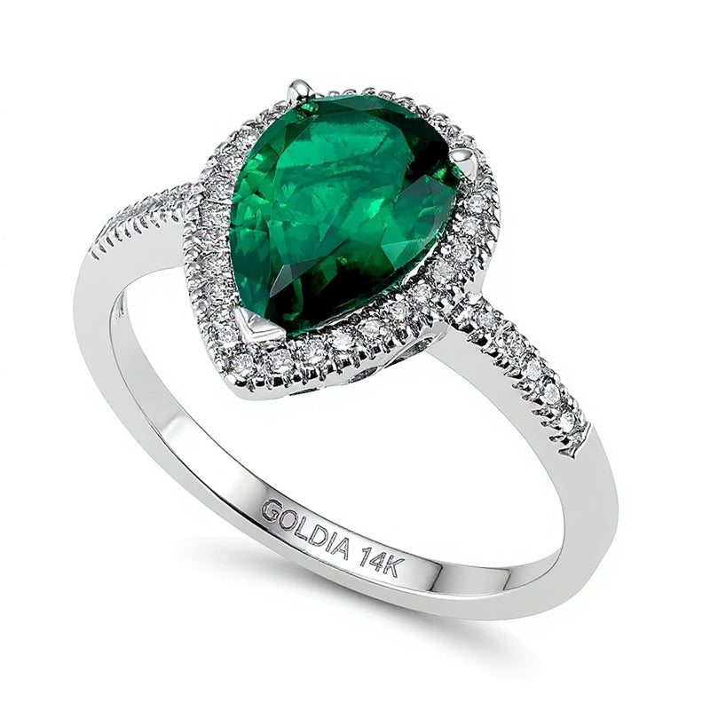 Halo-Ring mit tropfenförmigem Labor-Smaragd und 0,2 ct. Gesamtgewicht Diamanten in 14K Weißgold