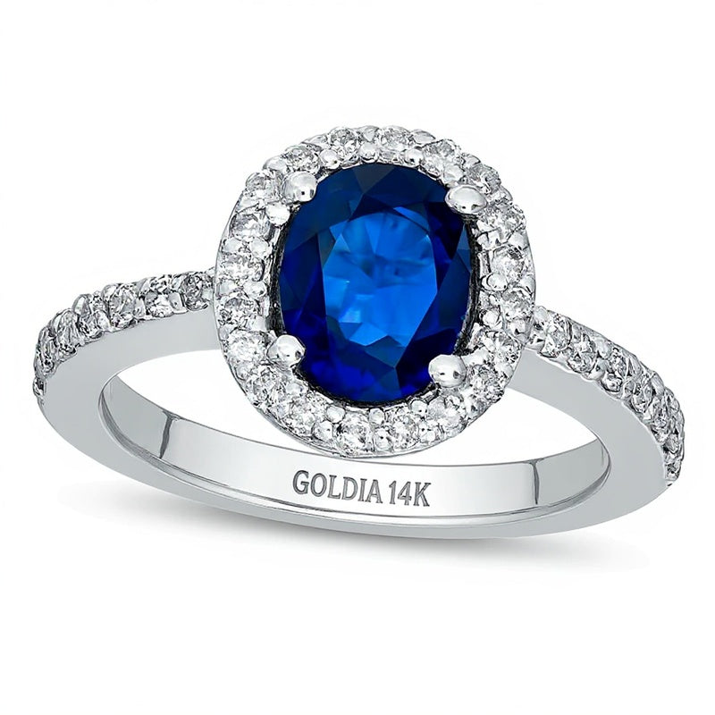 Verlobungsring mit ovalem blauem Saphir und 0,5 ct. Gesamtgewicht Diamanten im Halo aus 14K Weißgold