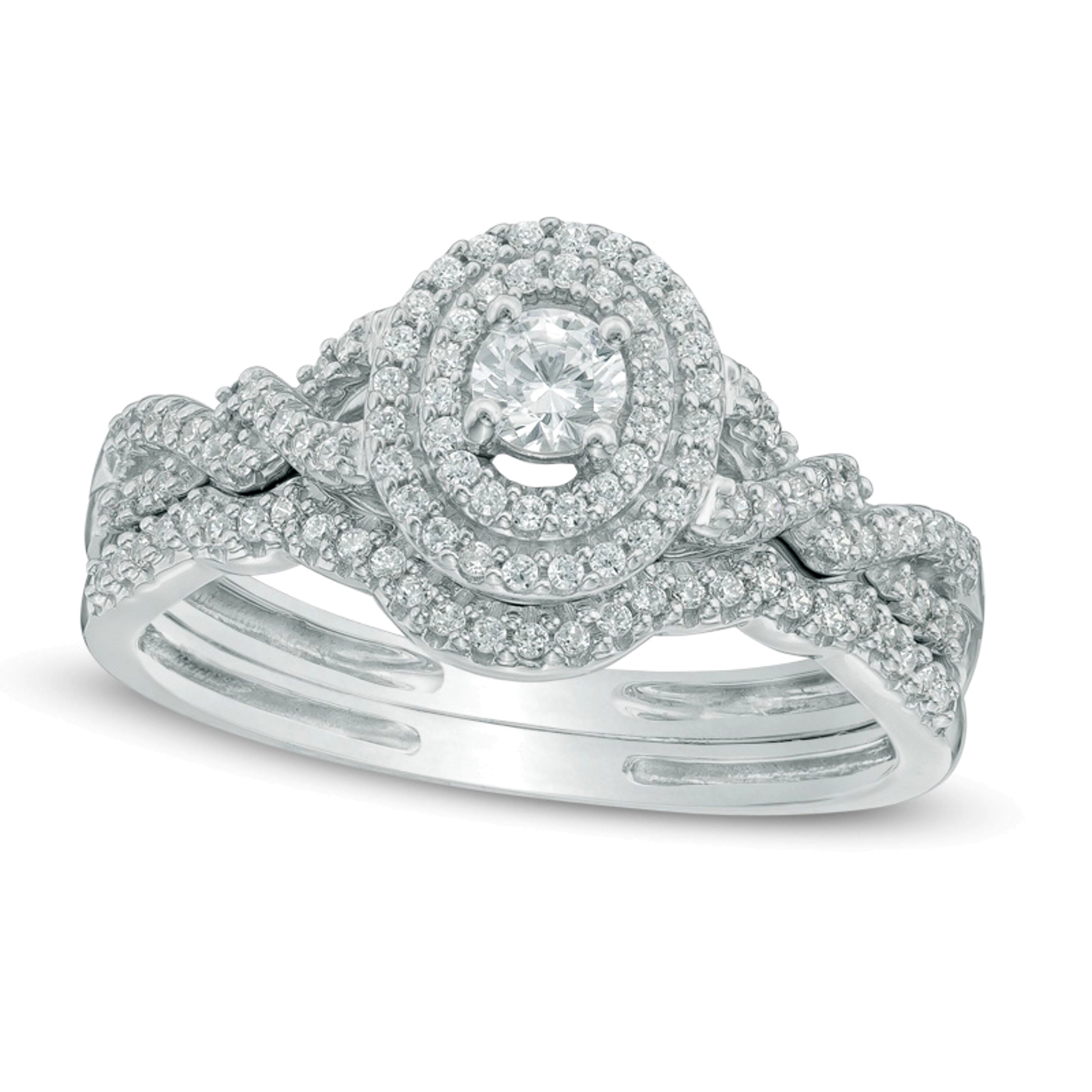 0.5 ct. Gesamtgewicht Diamant Braut-Set mit ovalem Rahmen und geflochtener Schiene in 10K Weißgold