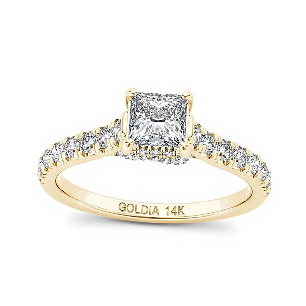 0.75 ct. Gesamtgewicht Solitär mit seitlichem Besatz mit Diamanten im Princess- und Rundschliff in 14K Gelbgold