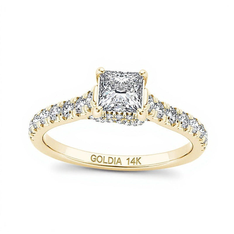 0.75 ct. Gesamtgewicht Solitär mit seitlichem Besatz mit Diamanten im Princess- und Rundschliff in 14K Gelbgold