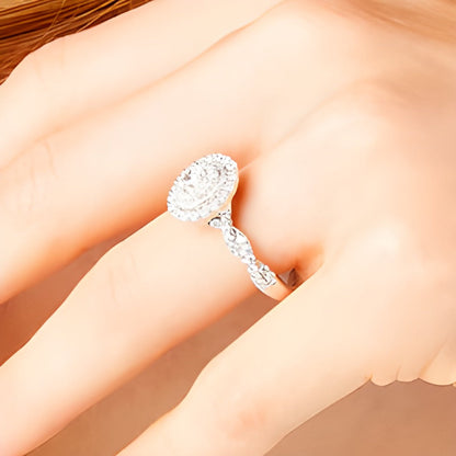 0.63 ct. Gesamtgewicht Verlobungsring mit Diamanten in Oval und rund im Vintage-Stil mit gedrehter Ringschiene aus 10K Weißgold