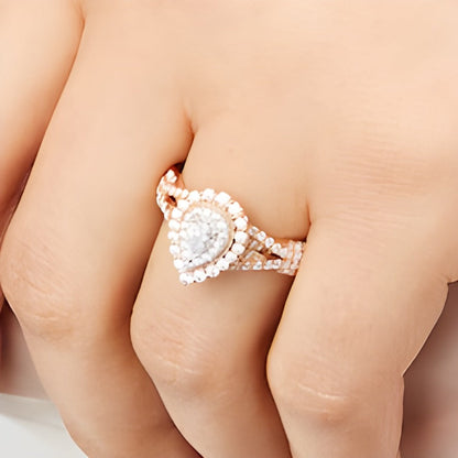 0.63 ct. Gesamtgewicht Verlobungsring mit tropfenförmigem Diamant, Halo und verschlungener Ringschiene in 10K Roségold