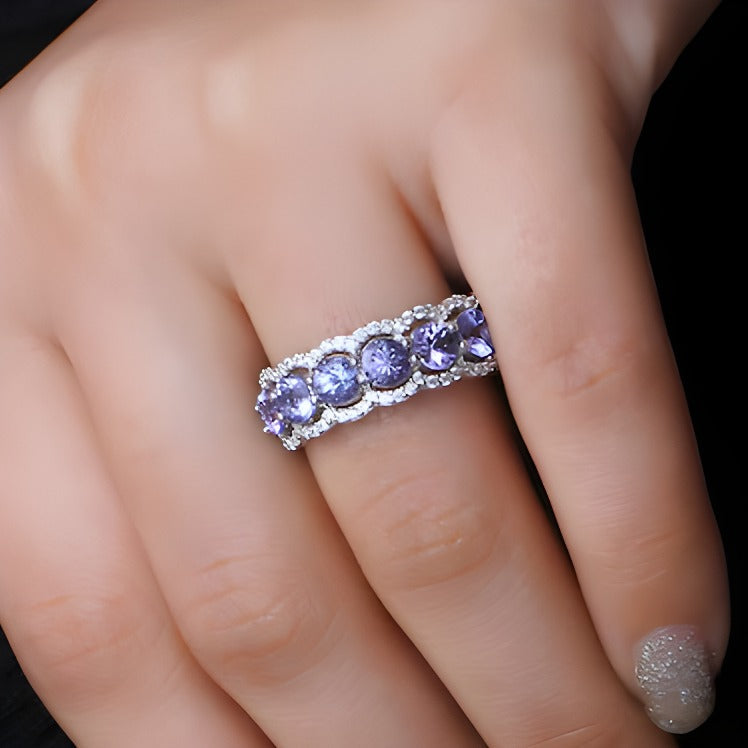 4,0mm Tansanit und weißer synthetischer Zirkon Sieben-Stein-Ring mit Wellenrand aus rhodiniertem Sterlingsilber