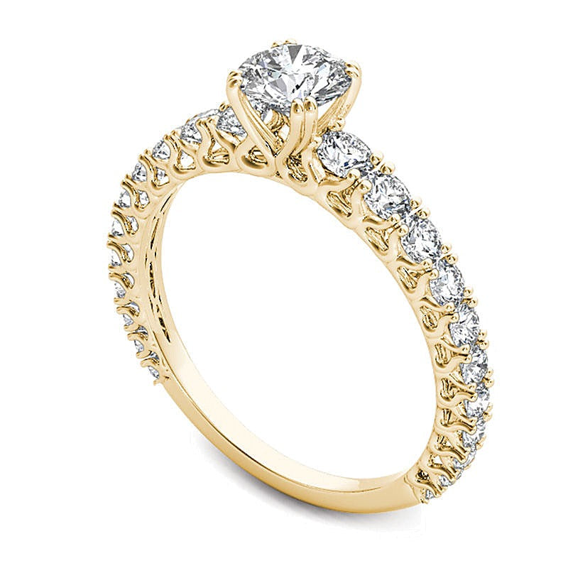 Solitär-Verlobungsring mit seitlichem Besatz mit weißen Diamanten im Rundschliff 1.0 ct. Gesamtgewicht in 14K Gelbgold
