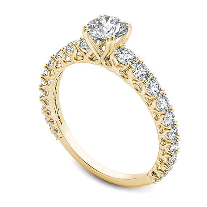 Solitär-Verlobungsring mit seitlichem Besatz mit weißen Diamanten im Rundschliff 1.0 ct. Gesamtgewicht in 14K Gelbgold