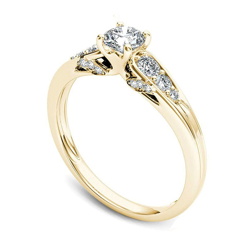 Solitär-Verlobungsring mit seitlichem Besatz mit weißen runden Diamanten, 0,63 ct. Gesamtgewicht, in 14K Gelbgold