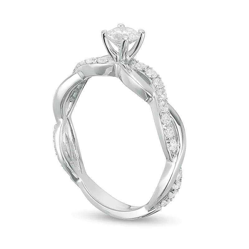 Solitär mit seitlichem Besatz mit Diamanten 1.0 ct. Gesamtgewicht in 14K Weißgold