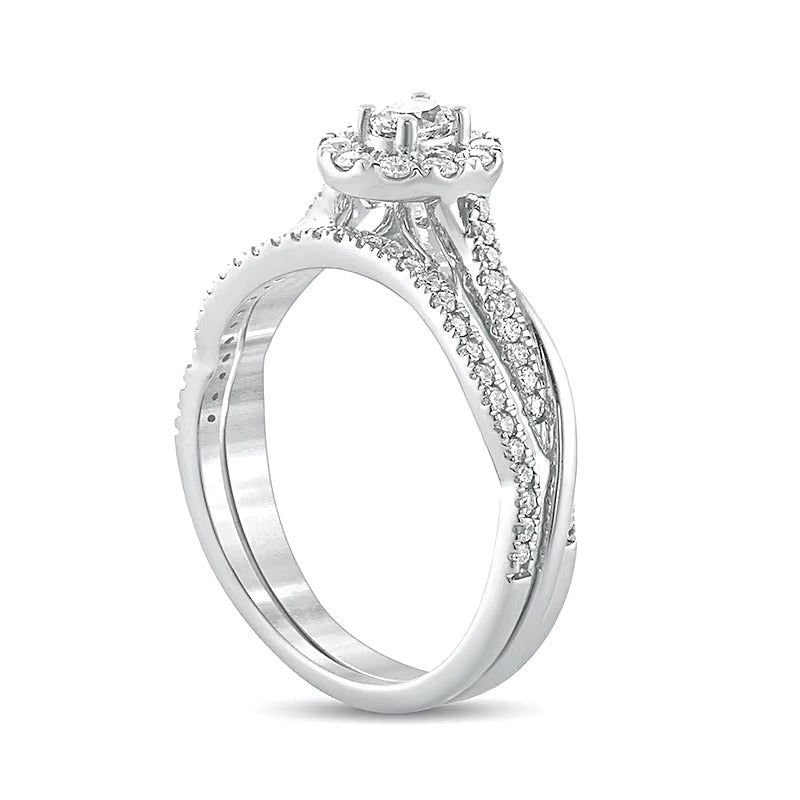 Brautset mit ovalem Diamant 0.5 CT. Gesamtgewicht und gedrehter Ringschiene in 10K Weißgold