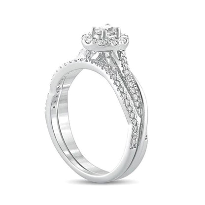 Brautset mit ovalem Diamant 0.5 CT. Gesamtgewicht und gedrehter Ringschiene in 10K Weißgold