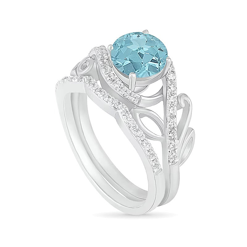 7,0 mm Aquamarin und 0,38 ct. Gesamtgewicht Diamant Bypass Brautset mit Blattdesign-Ringschiene in 10K Weißgold