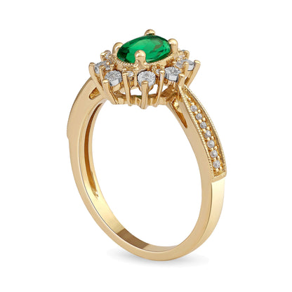 Ring mit ovalem Smaragd und 0,1 ct. Gesamtgewicht Diamanten im Vintage-Stil mit Sunburst-Fassung und verjüngter Ringschiene aus 10K Gold