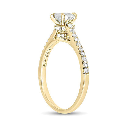 0,75 ct. Gesamtgewicht Solitär mit seitlichem Besatz mit Diamanten in Tropfen- und Rundschliff in 14K Gelbgold (I/I2)