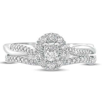 Brautset mit ovalem Diamant 0.5 CT. Gesamtgewicht und gedrehter Ringschiene in 10K Weißgold