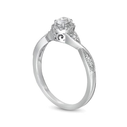 0.33 ct. Gesamtgewicht Verlobungsring mit Halo, ovalem Diamant und gedrehter Ringschiene in 14K Weißgold (I/SI2)