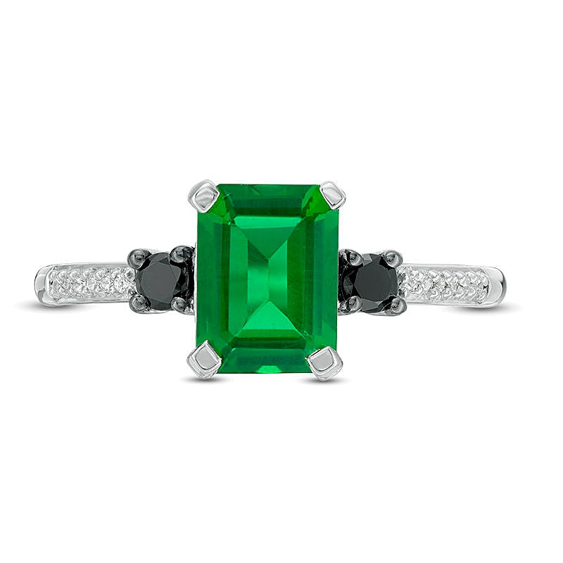Dreistein-Ring mit Smaragd im Smaragdschliff (Labor) und schwarzen sowie weißen Diamanten 0,13 ct. Gesamtgewicht in 10K Weißgold