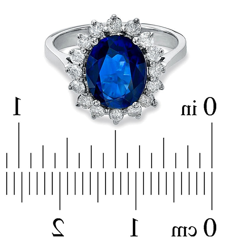 Halo-Ring mit ovalem blauem Saphir und Diamanten von 0,5 ct. Gesamtgewicht in 14K Weißgold