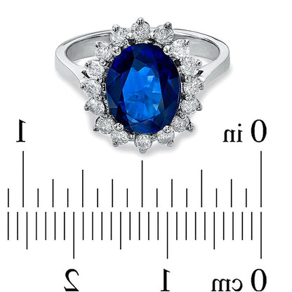 Halo-Ring mit ovalem blauem Saphir und Diamanten von 0,5 ct. Gesamtgewicht in 14K Weißgold