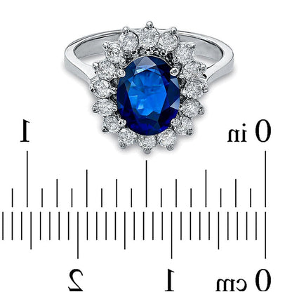 Halo-Ring mit ovalem blauem Saphir und 0,63 ct. Gesamtgewicht Diamanten in 14K Weißgold