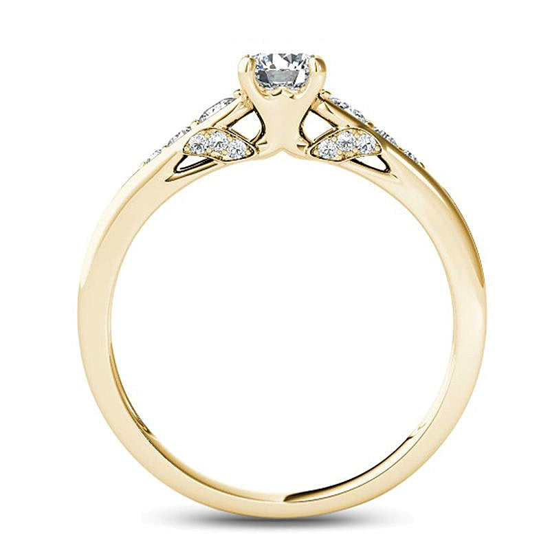 Solitär-Verlobungsring mit seitlichem Besatz mit weißen runden Diamanten, 0,63 ct. Gesamtgewicht, in 14K Gelbgold