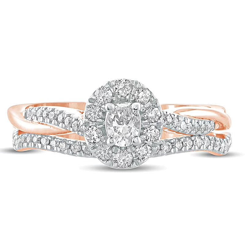 0,5 ct. Gesamtgewicht Braut-Set mit ovalem Diamant, Halo und gedrehter Ringschiene in 10K Roségold