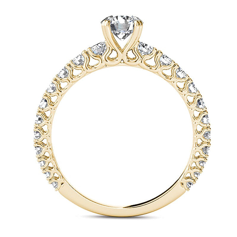 Solitär-Verlobungsring mit seitlichem Besatz mit weißen Diamanten im Rundschliff 1.0 ct. Gesamtgewicht in 14K Gelbgold