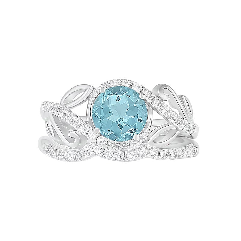 7,0 mm Aquamarin und 0,38 ct. Gesamtgewicht Diamant Bypass Brautset mit Blattdesign-Ringschiene in 10K Weißgold