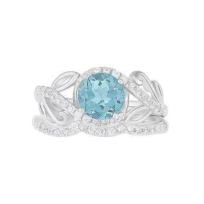 7,0 mm Aquamarin und 0,38 ct. Gesamtgewicht Diamant Bypass Brautset mit Blattdesign-Ringschiene in 10K Weißgold