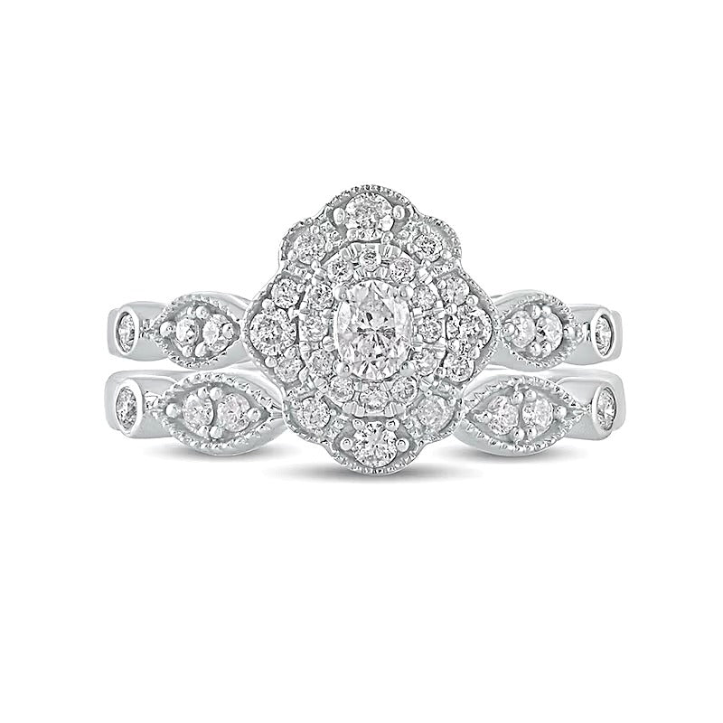0,63 ct. Gesamtgewicht Diamant-Brautset mit ovalem Mittelstein und Vintage-Doppelblüten-Fassung in 10K Weißgold