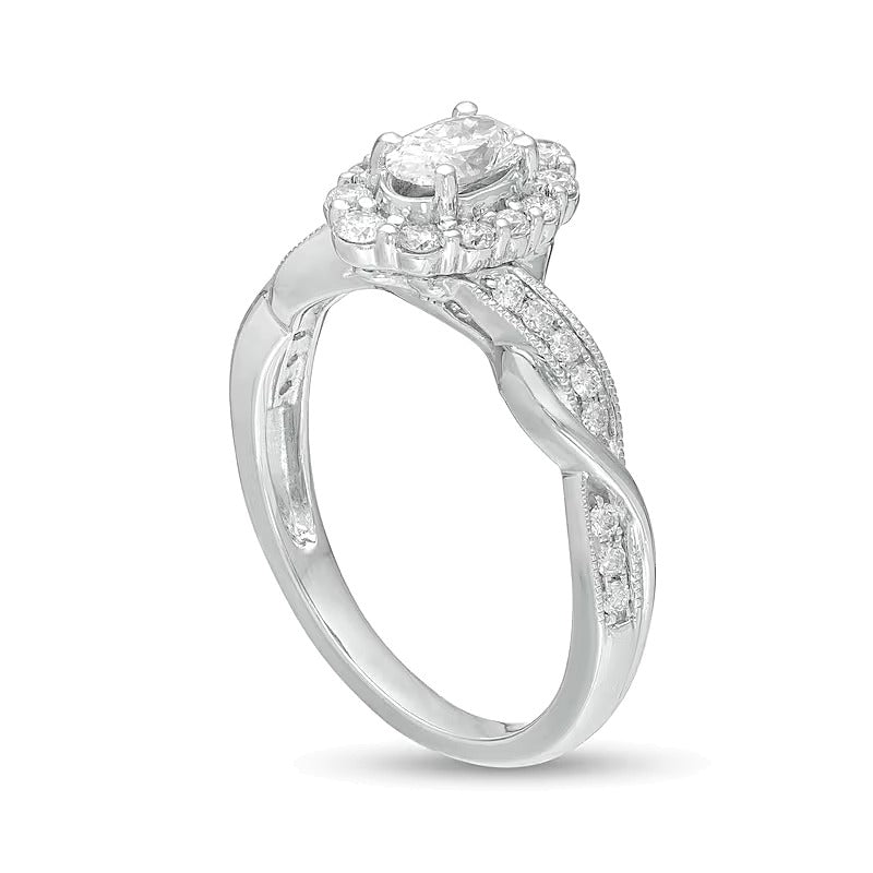 0,75 ct. Gesamtgewicht Verlobungsring im Vintage-Stil mit ovalem Diamant, Halo und gedrehtem Ring in 10K Weißgold