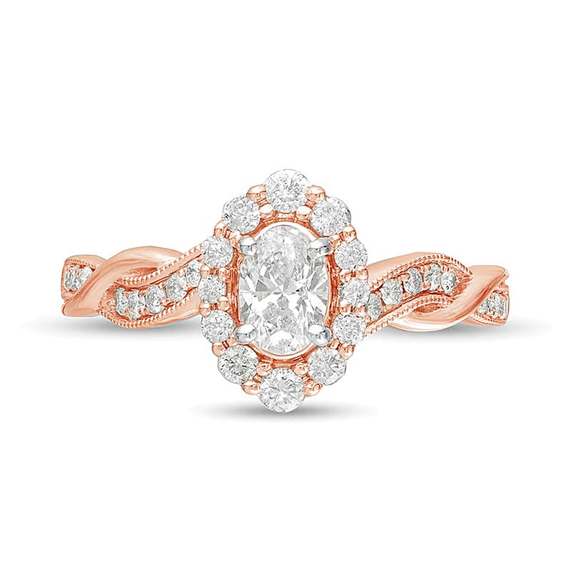 0,75 ct. Gesamtgewicht Verlobungsring im Vintage-Stil mit ovalem Diamanten, Halo und gedrehter Ringschiene in 10K Roségold