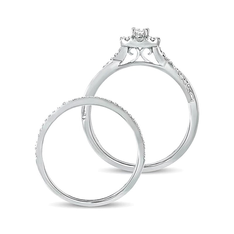 Brautset mit ovalem Diamant 0.5 CT. Gesamtgewicht und gedrehter Ringschiene in 10K Weißgold