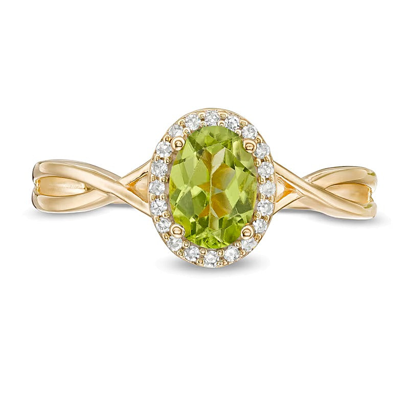 Ring mit ovalem Peridot und 0,07 ct. Gesamtgewicht Diamanten mit Rahmen und gedrehter Ringschiene in 10K Gelbgold