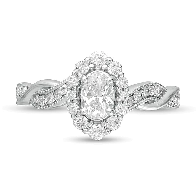 0,75 ct. Gesamtgewicht Verlobungsring im Vintage-Stil mit ovalem Diamant, Halo und gedrehtem Ring in 10K Weißgold