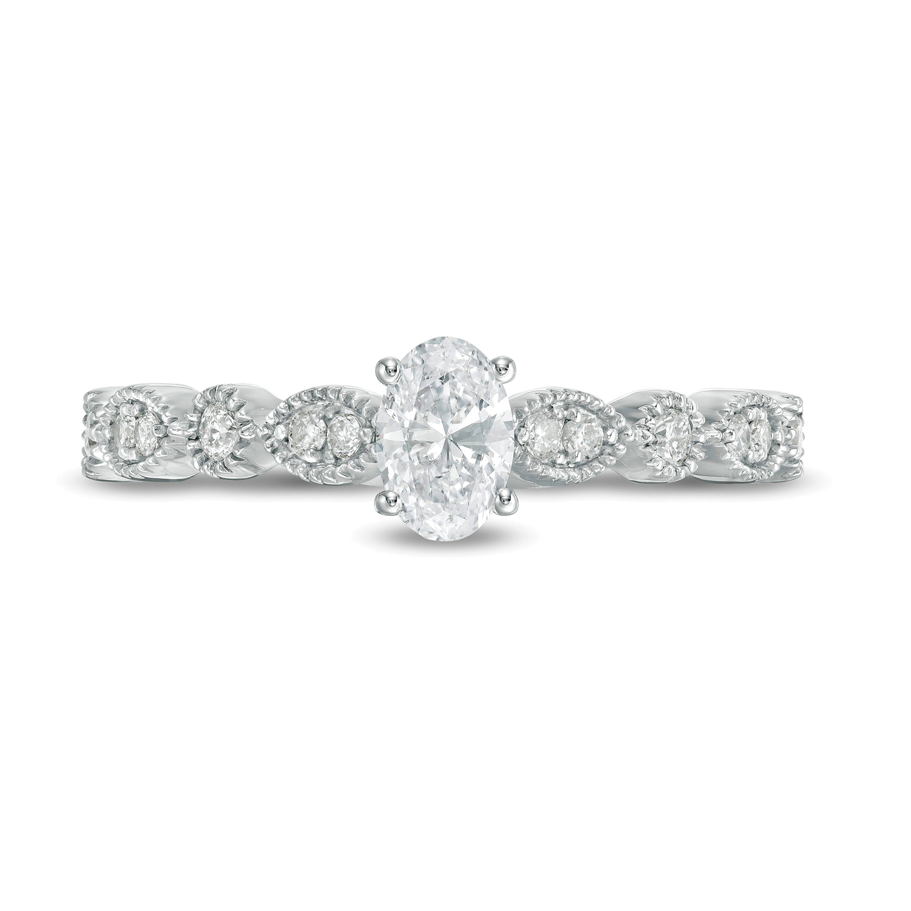 0,5 ct. Gesamtgewicht Solitär mit seitlichem Besatz mit ovalem Diamant und Marquise-Formen im Vintage-Stil in 10K Weißgold