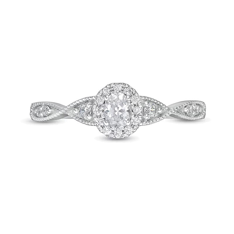 0.33 ct. Gesamtgewicht Verlobungsring mit Halo, ovalem Diamant und gedrehter Ringschiene in 14K Weißgold (I/SI2)