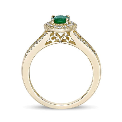Ring mit ovalem Smaragd und 0,25 ct. Gesamtgewicht Diamanten mit Halo und geteilter Ringschiene in 10K Gelbgold