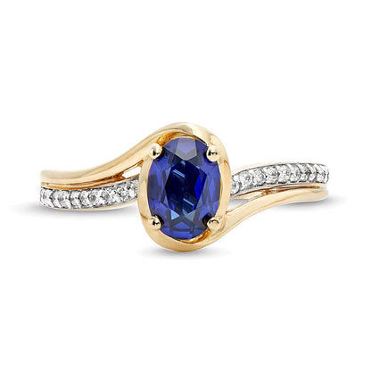 Solitär mit seitlichem Besatz mit ovalem blauem Labor-Saphir und 0.1 ct. Gesamtgewicht Diamant in 10K Gelbgold