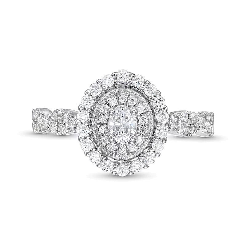 0.63 ct. Gesamtgewicht Verlobungsring mit Diamanten in Oval und rund im Vintage-Stil mit gedrehter Ringschiene aus 10K Weißgold