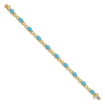 14 Karat Gelbgold Armband mit ovalem blauem Topas, 7 x 5 mm