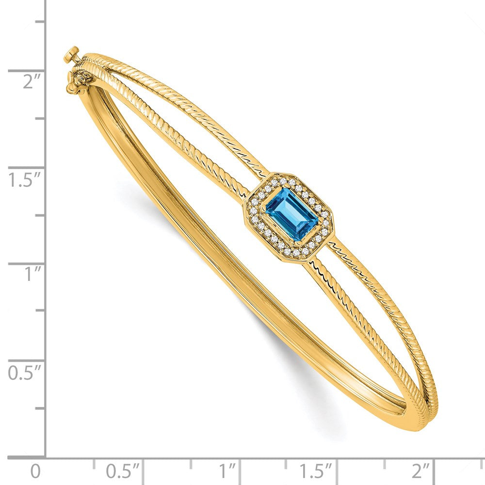 14 Karat Gelbgold-Armreif mit Blautopas im Smaragdschliff und natürlichen Diamanten in Halo-Fassung