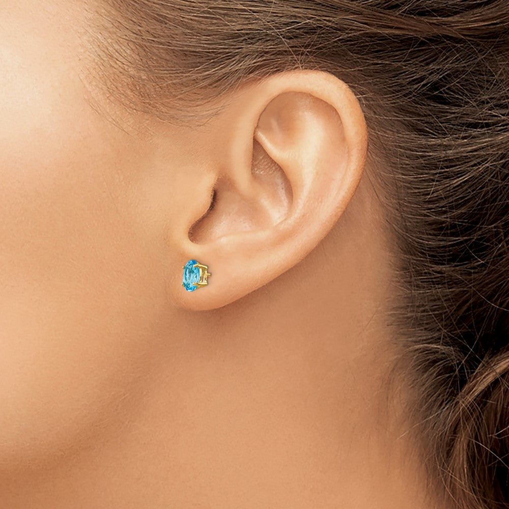 14K Gelbgold Ohrringe mit ovalem blauem Topas, 7 x 5 mm