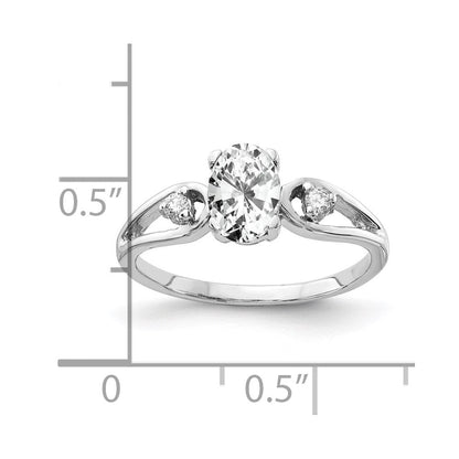 Ring aus 14K Weißgold mit 7x5mm ovalem Zirkonia und einem echten Diamanten