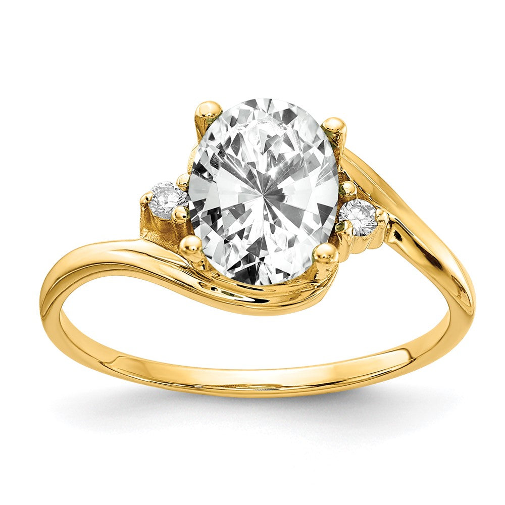 Ring aus 14K Gelbgold mit ovalem 8x6 mm Zirkonia und einem echten Diamanten